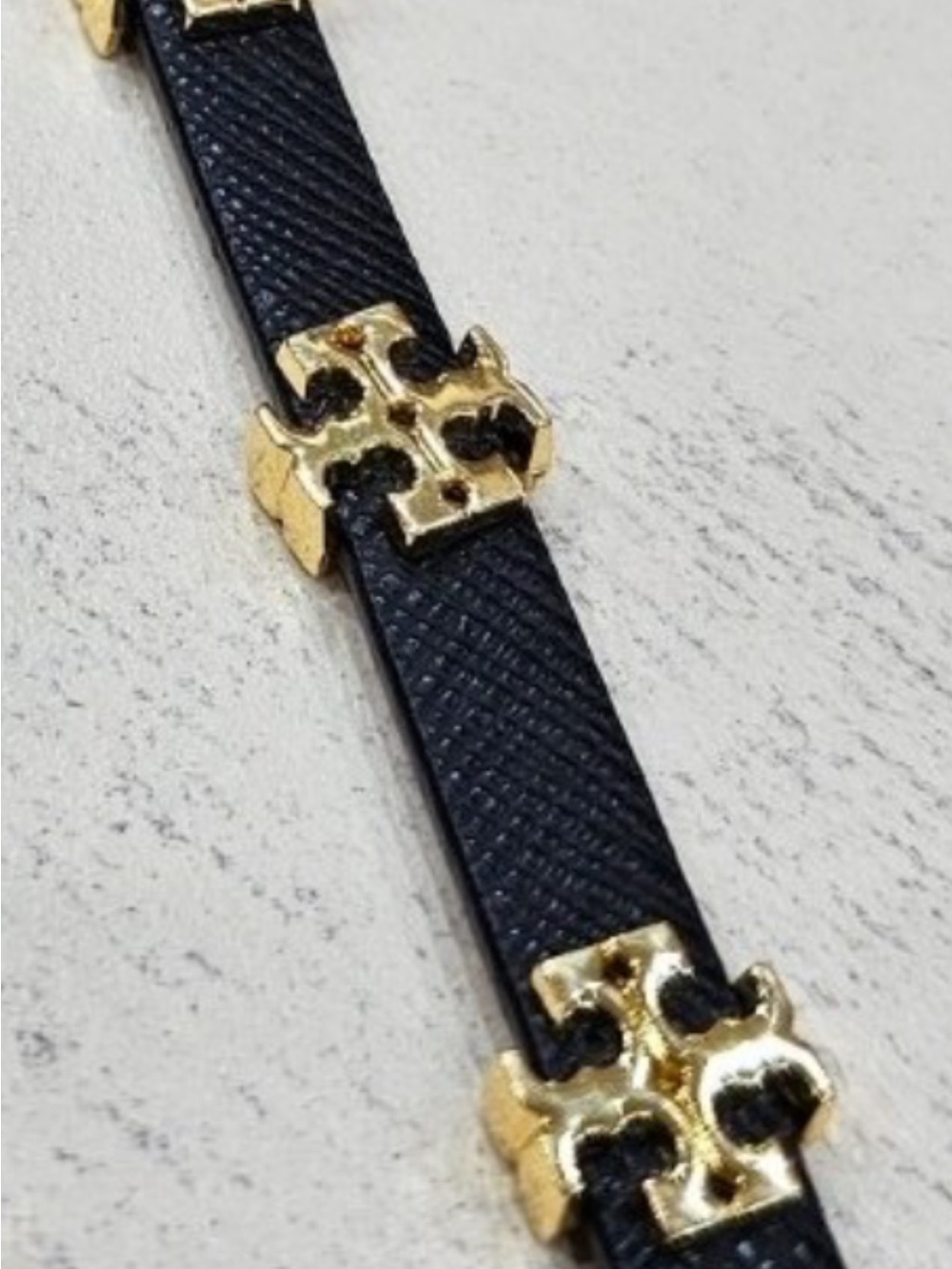 T logo Leather belt Bracelet in black with Gold Accents